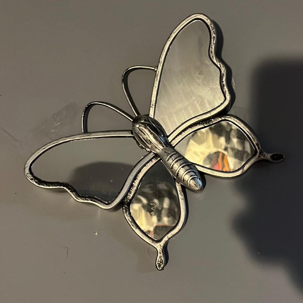 Sits perfectly on wall and is a pretty decor anywhere